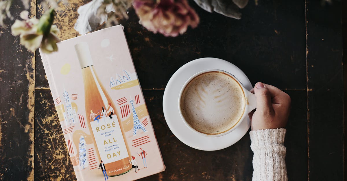 Does milk matter to achieve the perfect latte? - A hand holding a cup of beverage Does milk matter to achieve the perfect latte? - A hand holding a cup of beverage
