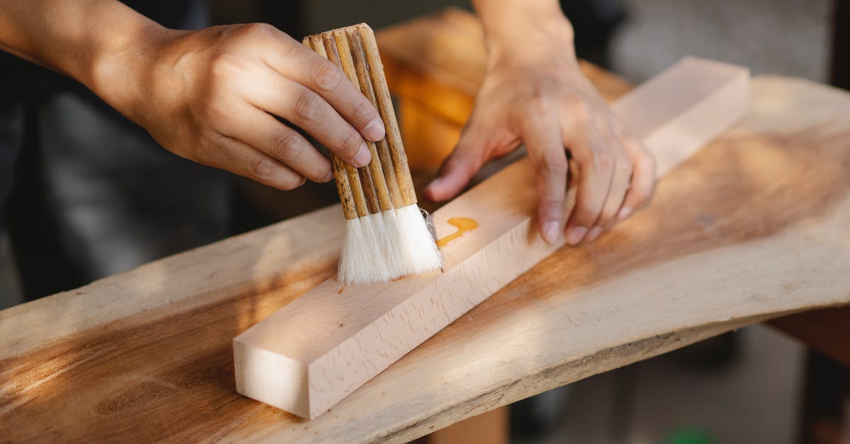 Does oil oxidation create trans fats? - Craftsman smearing wooden plank with oil Does oil oxidation create trans fats? - Craftsman smearing wooden plank with oil