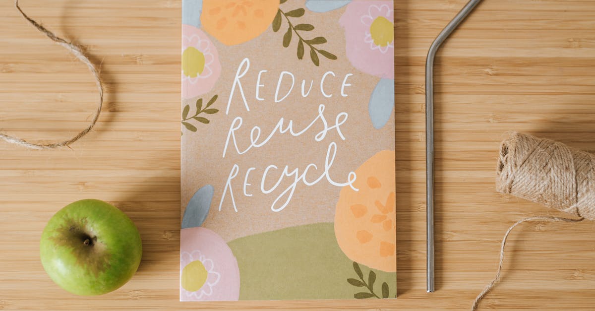 Does reducing fruit change its composition? - Top view of book with Reduce Reuse Recycle inscriptions near green apple and bobbin of thread on table Does reducing fruit change its composition? - Top view of book with Reduce Reuse Recycle inscriptions near green apple and bobbin of thread on table