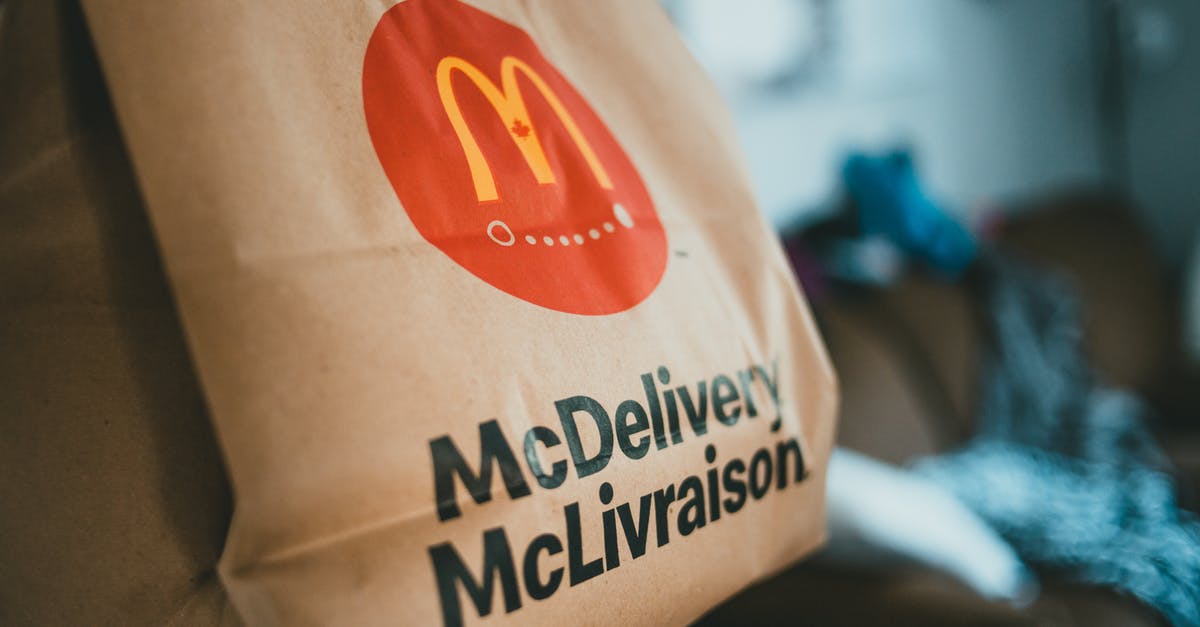 Does saturated fat result in crispier fried food? - Brown packet with hot fresh food delivered at home on blurred background in daytime Does saturated fat result in crispier fried food? - Brown packet with hot fresh food delivered at home on blurred background in daytime