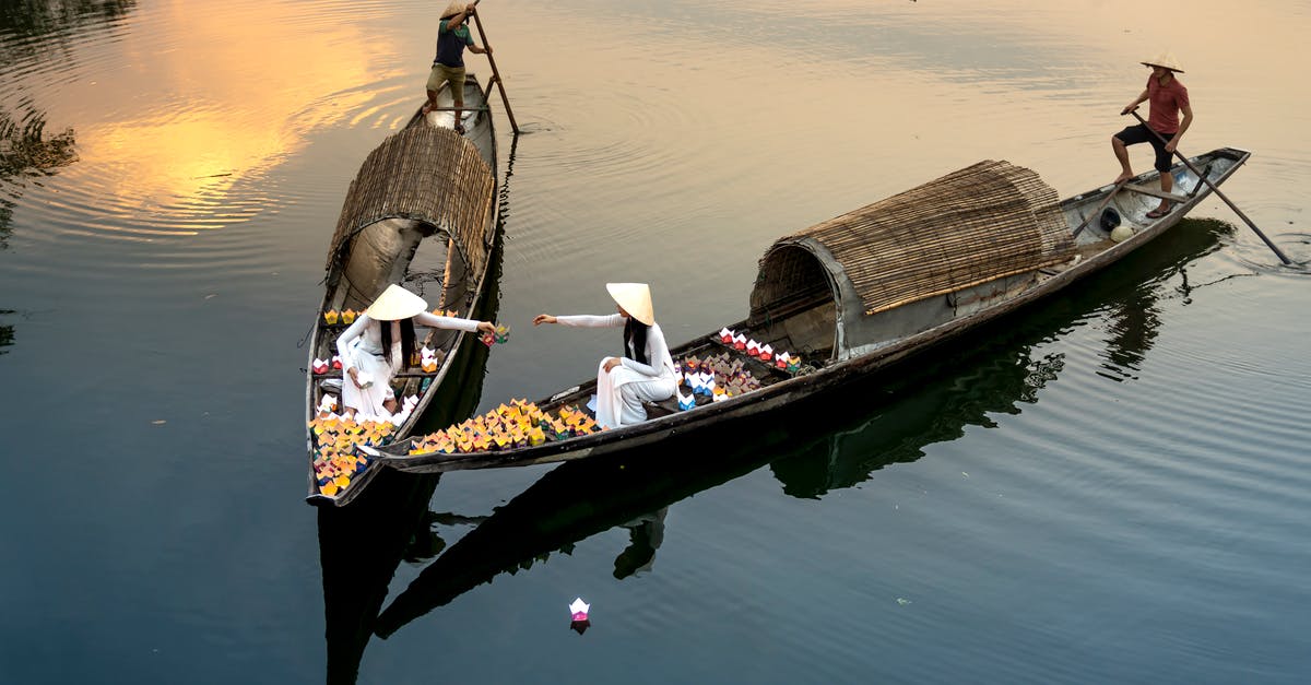 Does steeping the same amount of tea in different volumes of water lead to the same or more caffeine? [duplicate] - From above of anonymous female talking in boats against male with paddles sailing on lake during lantern festival in twilight