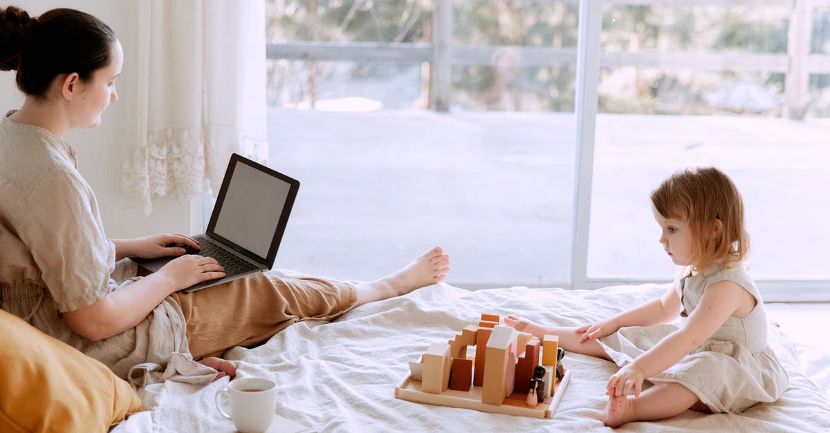 Does tea play a significant role in kombucha fermentation? - Side view of casual woman sitting on bed and surfing laptop with blank screen while adorable kid playing with toys in cozy bedroom Does tea play a significant role in kombucha fermentation? - Side view of casual woman sitting on bed and surfing laptop with blank screen while adorable kid playing with toys in cozy bedroom