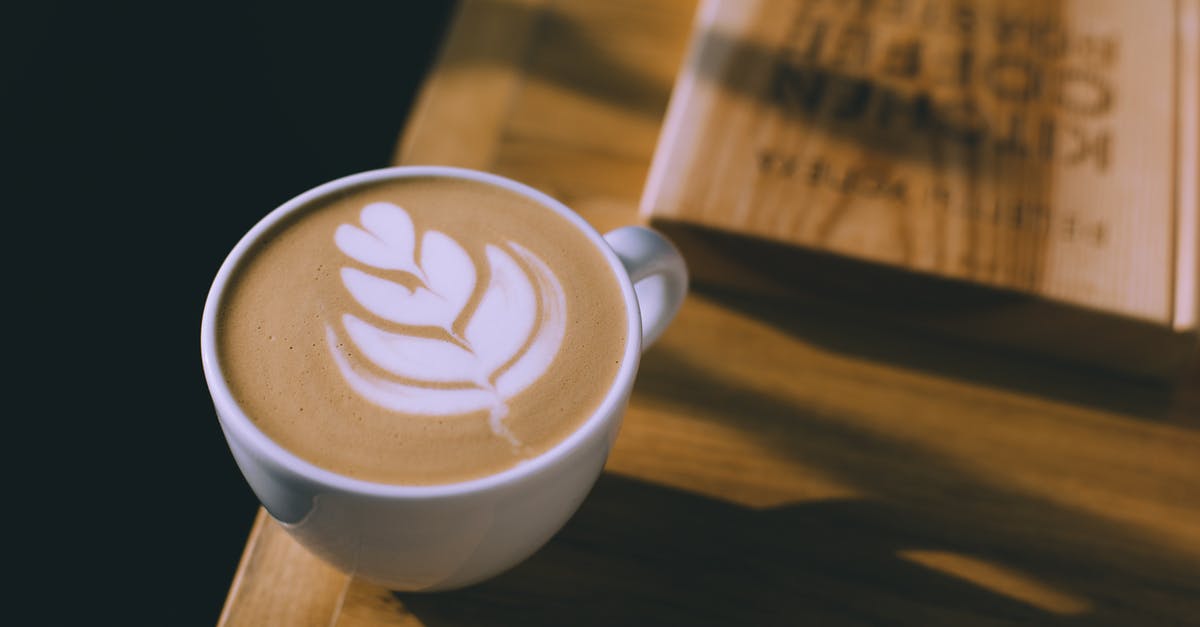 Does the foam head affect the taste of cola? - Cup of coffee with art on milky foam Does the foam head affect the taste of cola? - Cup of coffee with art on milky foam