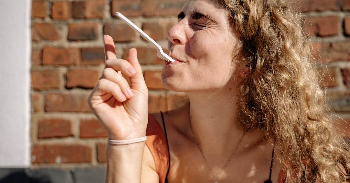 Does the PH in your mouth affect taste? - Woman Holding Fork with Her Mouth Does the PH in your mouth affect taste? - Woman Holding Fork with Her MouthÂ