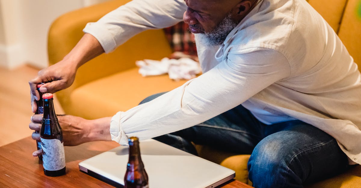 Does the speed of opening of a bottle of wine influence its flavour? - Bald Bearded Man Opening Bottle Does the speed of opening of a bottle of wine influence its flavour? - Bald Bearded Man Opening Bottle