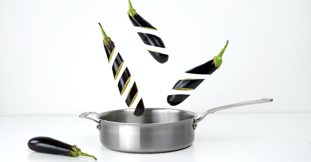 Dosa on clad stainless steel pan - Three Sliced Eggplants and Gray Stainless Steel Non-stick Pan