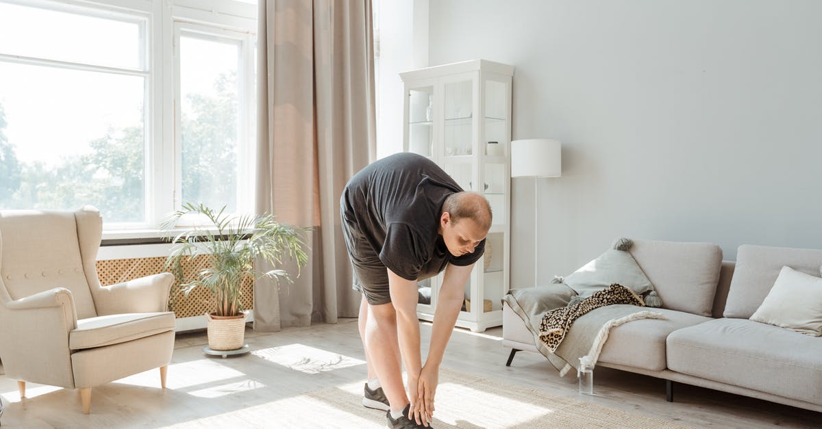 Dough is super springy and sticky. Tears while stretching - Man in Gray T-shirt and Black Shorts Kneeling on Floor Dough is super springy and sticky. Tears while stretching - Man in Gray T-shirt and Black Shorts Kneeling on Floor