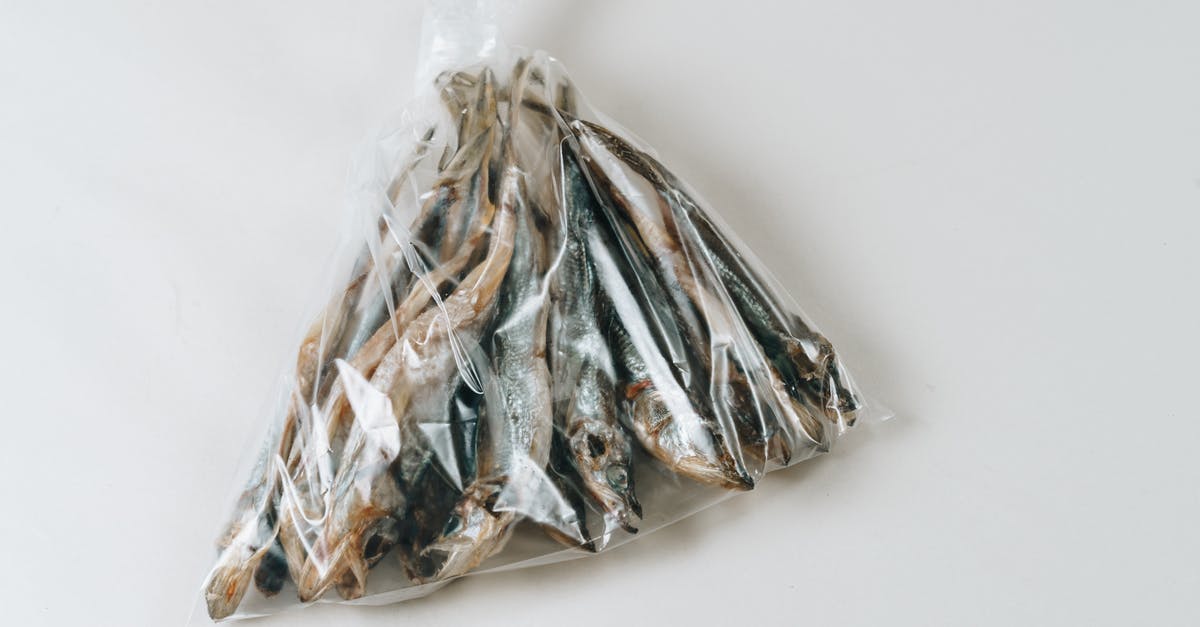 Dried and Salted Fish Fillets (e.g. cod) Sous Vide - Salted Dried Fishes in a Plastic Packed Dried and Salted Fish Fillets (e.g. cod) Sous Vide - Salted Dried Fishes in a Plastic Packed
