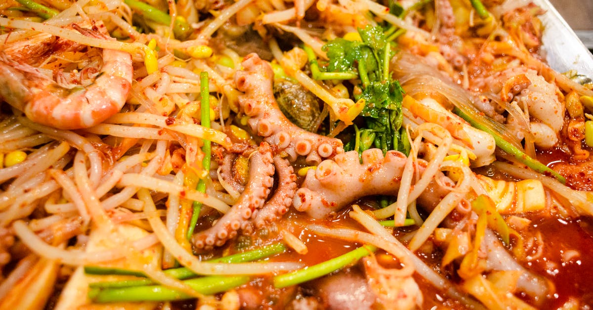 Dried beans, cooked in an acidic sauce, haven't softened enough - can I do anything now? - Close Up Photo of a Seafood Dish Dried beans, cooked in an acidic sauce, haven't softened enough - can I do anything now? - Close Up Photo of a Seafood Dish