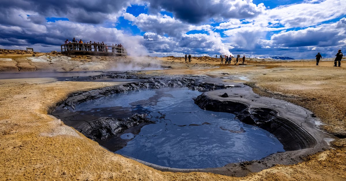 Dumping hot water without steam burns - Group of People Gather Near Hot Spring Dumping hot water without steam burns - Group of People Gather Near Hot Spring