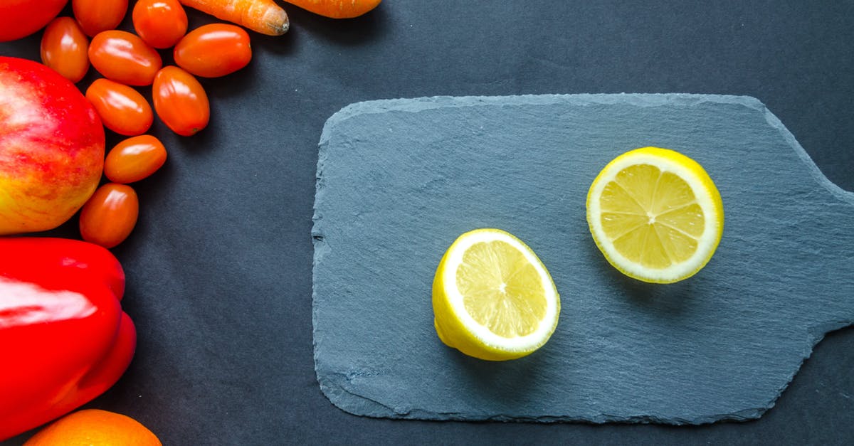 Eating raw fish: what are parasite infection risks really: how big? - Sliced Lemon on Blue Chopping Board Eating raw fish: what are parasite infection risks really: how big? - Sliced Lemon on Blue Chopping Board