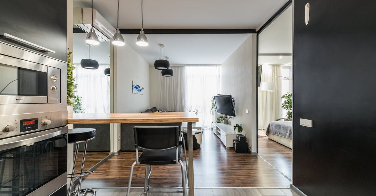 Electric oven Temperature - Modern kitchen with built in appliances in spacious apartment Electric oven Temperature - Modern kitchen with built in appliances in spacious apartment