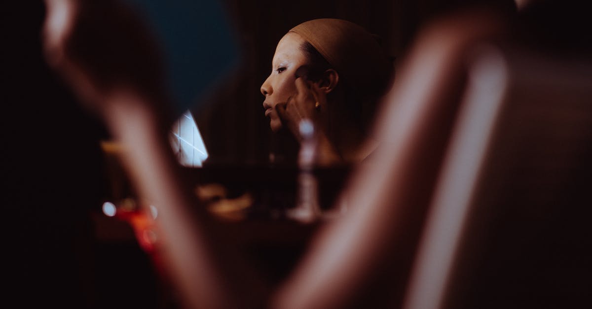 Emulating Starbucks Frappuccino Cream Base - Asian woman applying cosmetic on face Emulating Starbucks Frappuccino Cream Base - Asian woman applying cosmetic on face