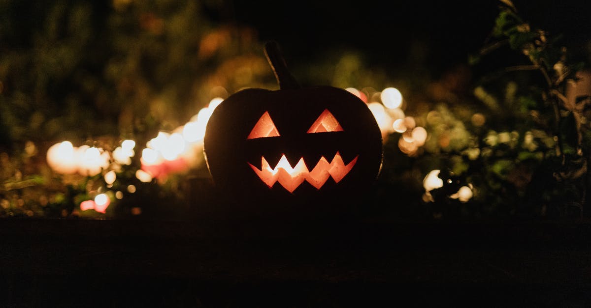 Exceptional pumpkin variants - Jack O Lantern on Brown Wooden Table Exceptional pumpkin variants - Jack O Lantern on Brown Wooden Table