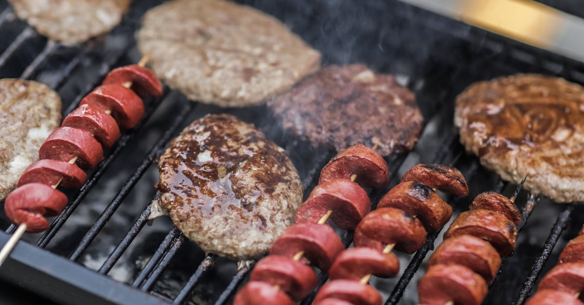 Extremely hard layer after cooking the burger on the grill - Grilled Spiral Sausage With Steak Extremely hard layer after cooking the burger on the grill - Grilled Spiral Sausage With Steak