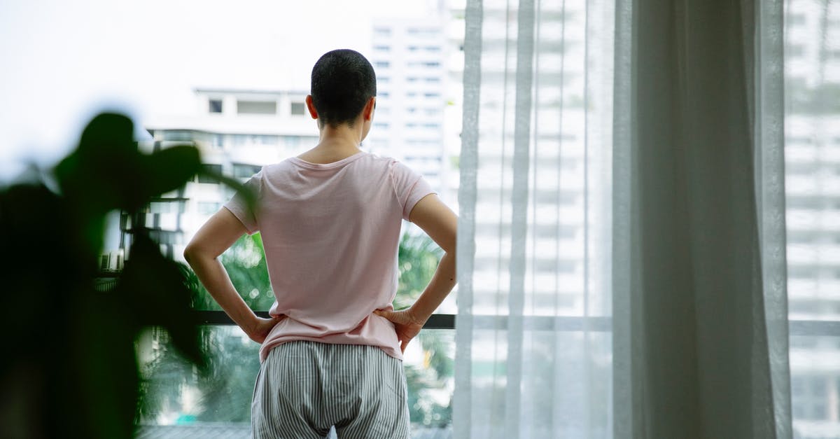 Extremely tender beef at hospital - Confident short haired woman with cancer on balcony of hospital Extremely tender beef at hospital - Confident short haired woman with cancer on balcony of hospital