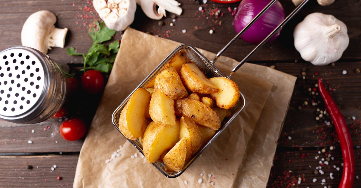 Fastest way to cook a baked potato? - Potato wedges placed on table amidst various seasonings Fastest way to cook a baked potato? - Potato wedges placed on table amidst various seasonings