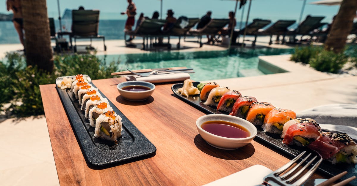 Fatty Tuna vs. Tuna - Sushi Roll on Tray and Table Fatty Tuna vs. Tuna - Sushi Roll on Tray and Table