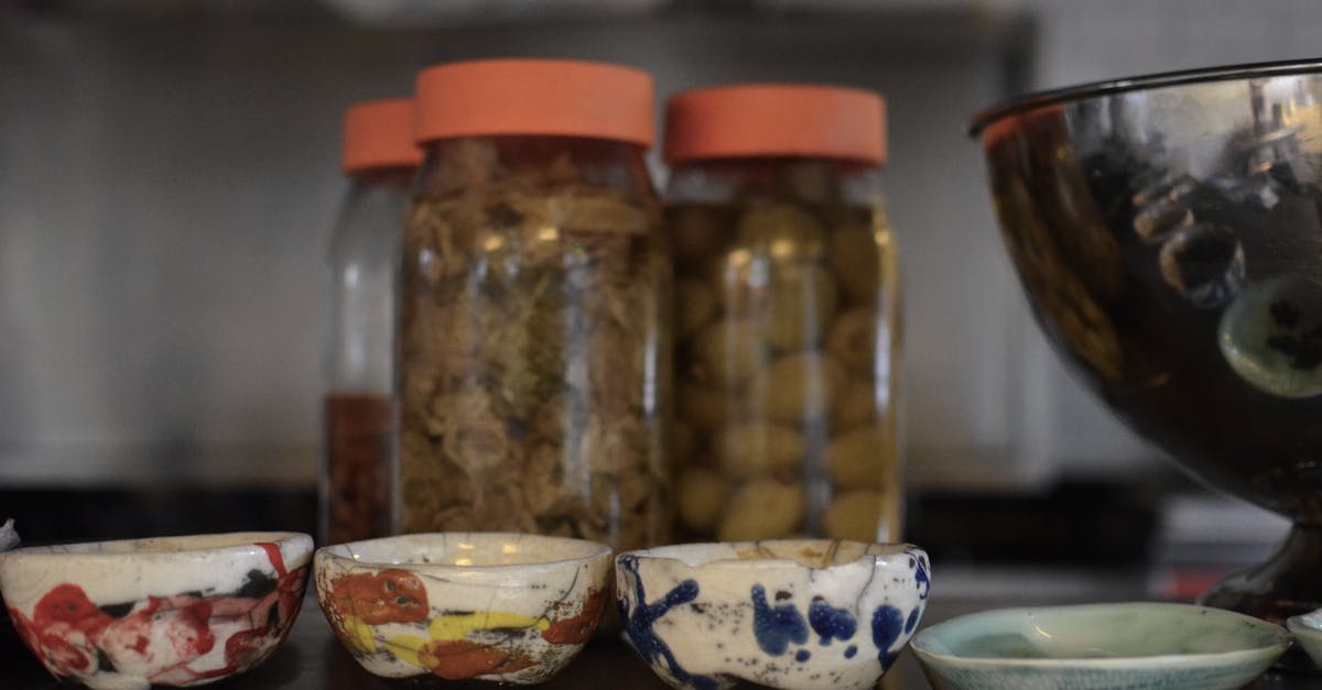 Fermenting pickles - Ceramic Bowls on the Table Fermenting pickles - Ceramic Bowls on the Table