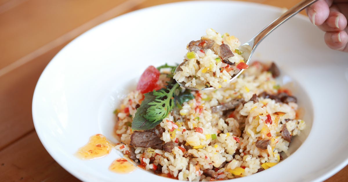 Firm risotto using generic rice. Is it possible? - A Person Scooping a Delicious Spicy Rice Meal Firm risotto using generic rice. Is it possible? - A Person Scooping a Delicious Spicy Rice Meal
