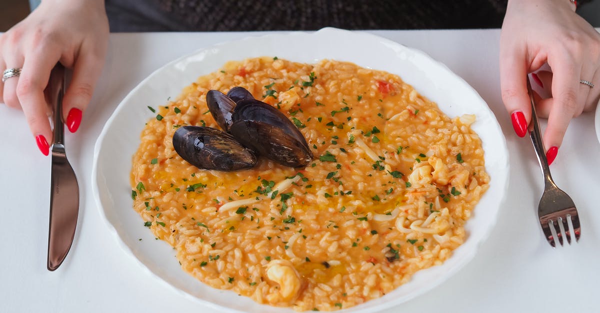 Firm risotto using generic rice. Is it possible? - A Delicious Rice Meal with Clams on White Plate Firm risotto using generic rice. Is it possible? - A Delicious Rice Meal with Clams on White Plate