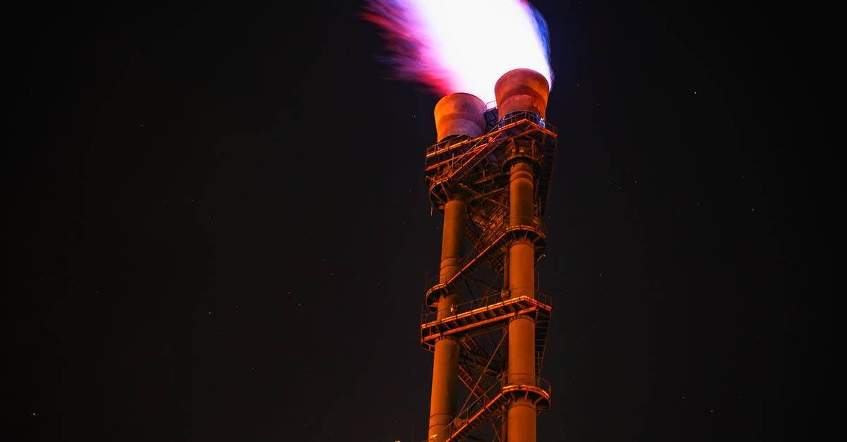 Flammable gas emitted by sausage - Low Angle View of Illuminated Tower Against Sky at Night Flammable gas emitted by sausage - Low Angle View of Illuminated Tower Against Sky at Night