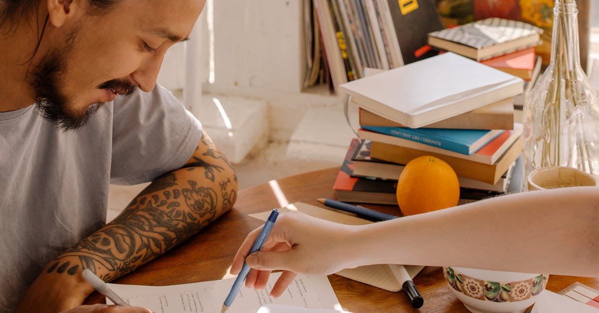 Flavor notes or profile of truffles? - Woman in White Long Sleeve Shirt Writing on White Paper Flavor notes or profile of truffles? - Woman in White Long Sleeve Shirt Writing on White Paper