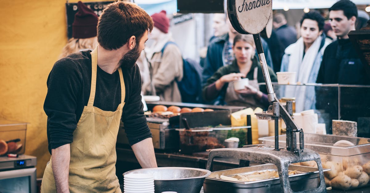 Food industry: where does buttermilk go? - Man Standing in Front of Bowl and Looking Towards Left Food industry: where does buttermilk go? - Man Standing in Front of Bowl and Looking Towards Left