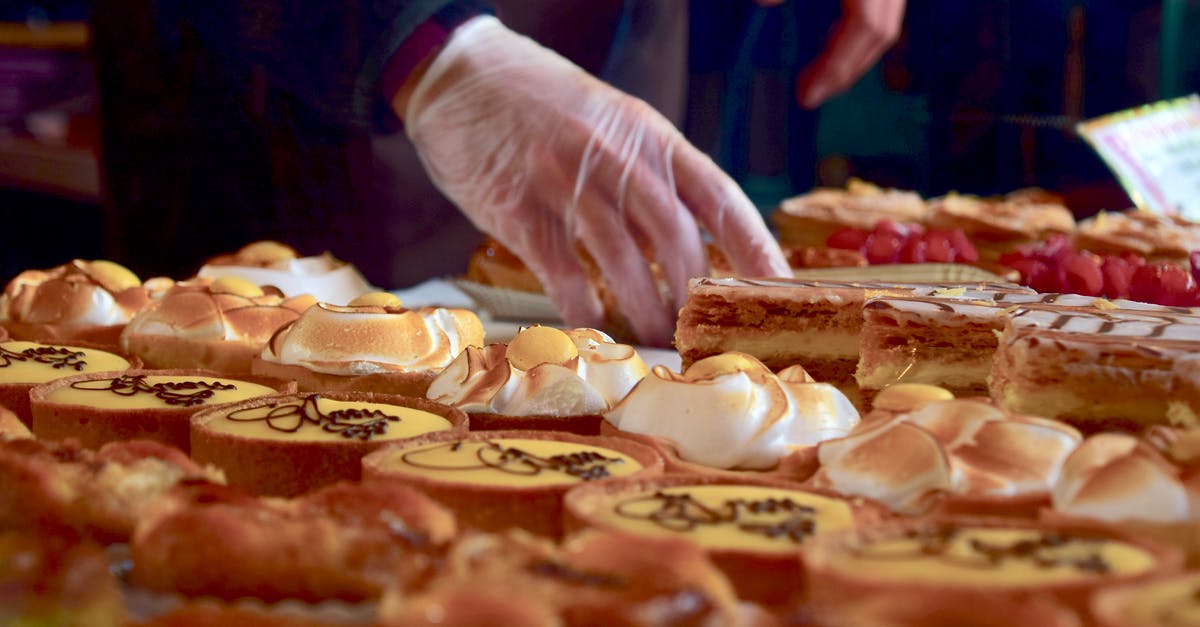 Food safety of custard slice - Person Holding a Cupcake Food safety of custard slice - Person Holding a Cupcake
