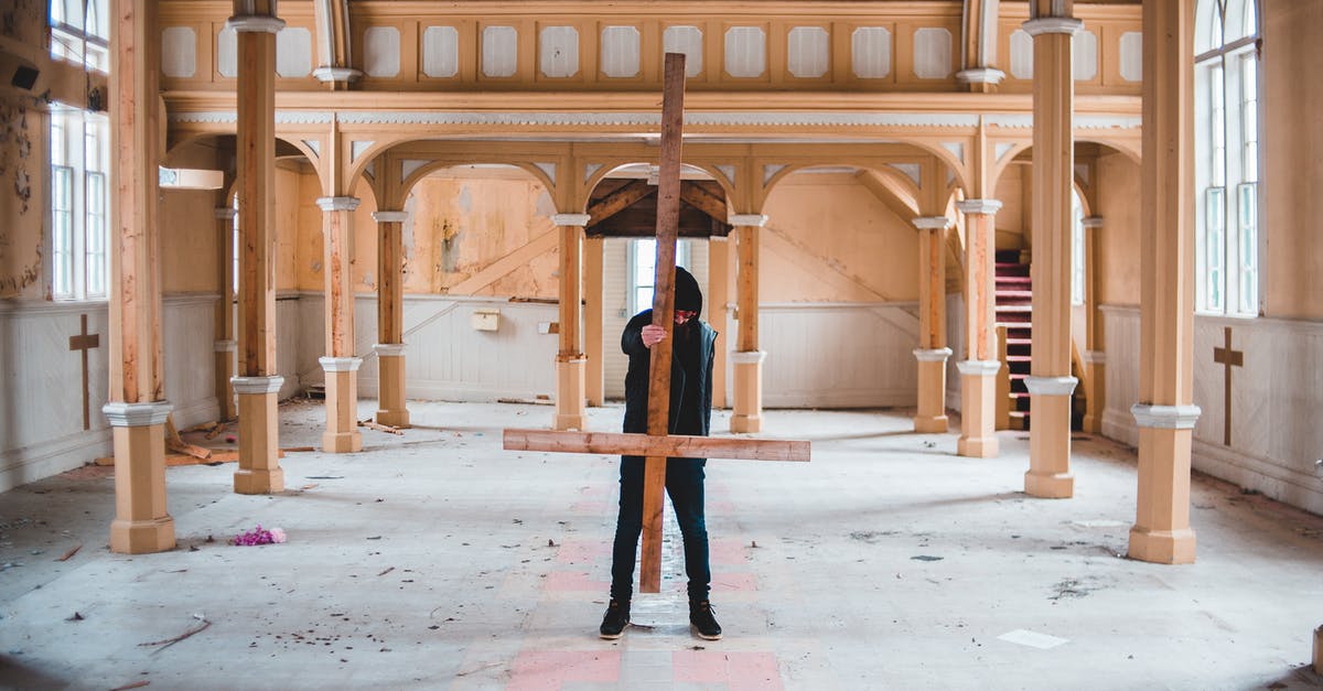 Forgot to feed my 6-day old sourdough starter yesterday, can I just carry on today? - Full body of unrecognizable male stalker in black clothing carrying overturned wooden Christian cross while walking through abandoned church