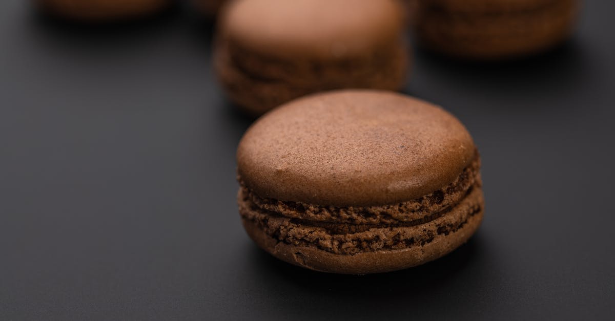 Forgot to put brown and white sugar in cookie dough - Chocolate sweet tasty macaroons on black background Forgot to put brown and white sugar in cookie dough - Chocolate sweet tasty macaroons on black background