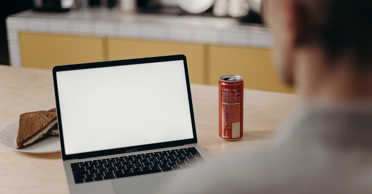 Freezing sandwiches for toasting at work - Red Can Beside Macbook Pro on Table