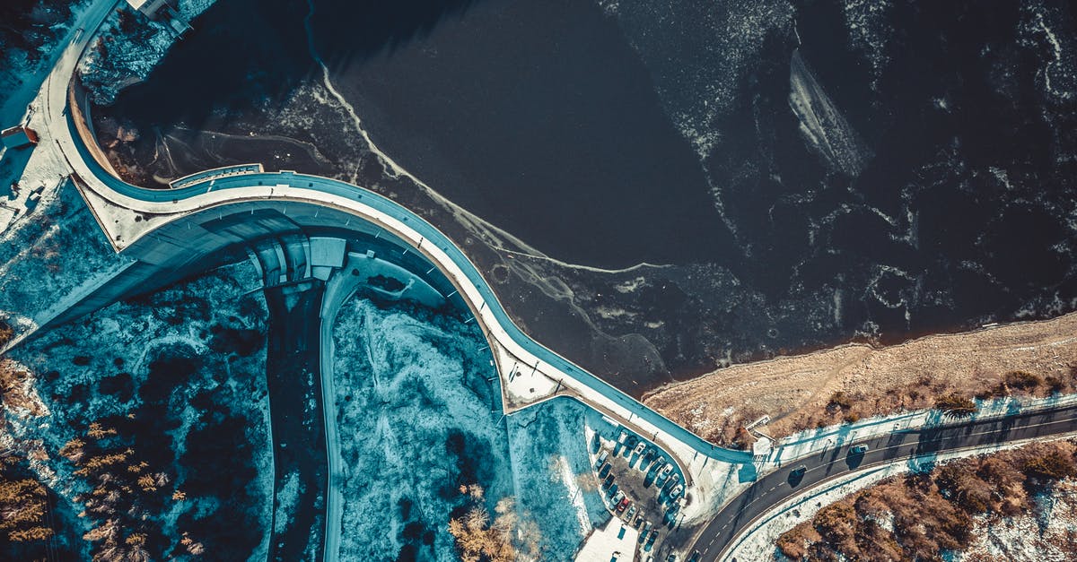 Freezing Soup Made Partly from Tins - Top-view Photography of Road Near the Body of Water Freezing Soup Made Partly from Tins - Top-view Photography of Road Near the Body of Water