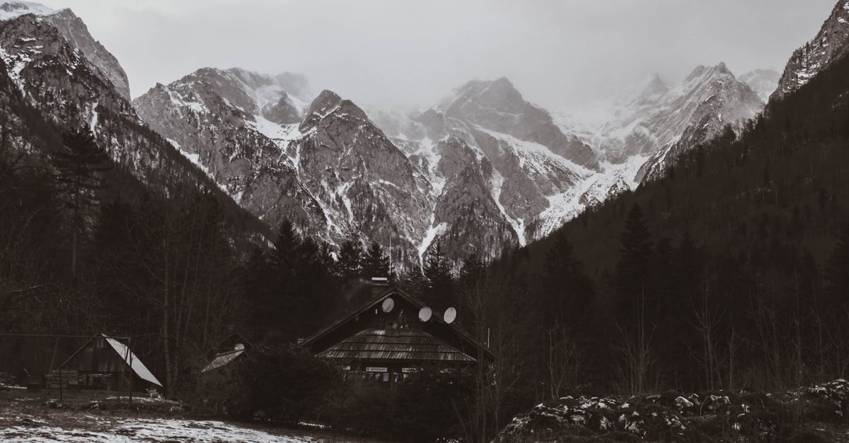 Freezing Tomatoes for Winter? - A Grayscale of a Cabin with Snow Covered Mountains on the Background Freezing Tomatoes for Winter? - A Grayscale of a Cabin with Snow Covered Mountains on the Background