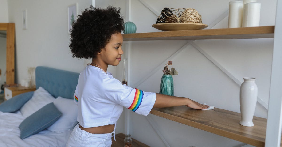 French Rolling Pin Care and Maintenance - Small girl cleaning shelf in apartment French Rolling Pin Care and Maintenance - Small girl cleaning shelf in apartment