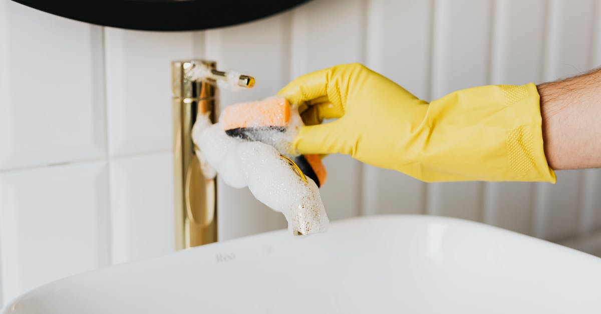 French Rolling Pin Care and Maintenance - Crop man washing faucet in bathroom French Rolling Pin Care and Maintenance - Crop man washing faucet in bathroom