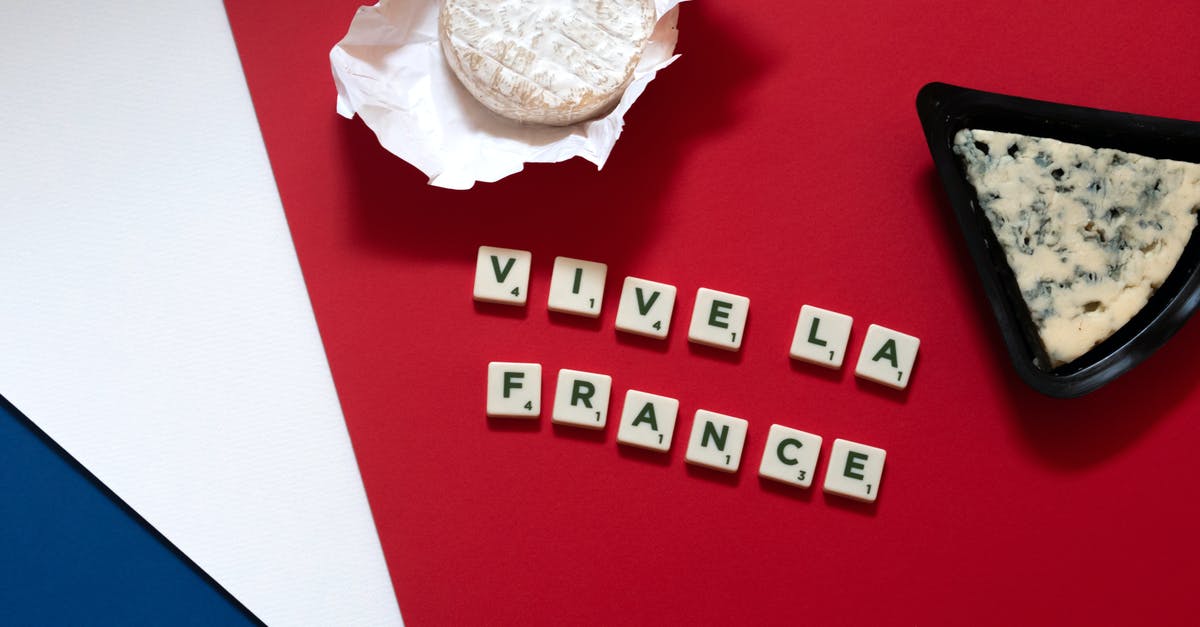 French soup cheese - Pack of Cheese on Red Surface French soup cheese - Pack of Cheese on Red Surface