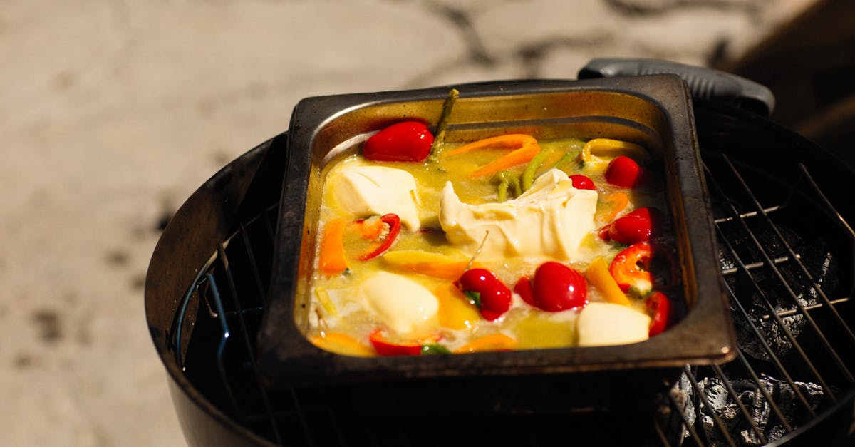 French soup cheese - A Metal Tray with Food Cooked over Charcoal Grill French soup cheese - A Metal Tray with Food Cooked over Charcoal Grill