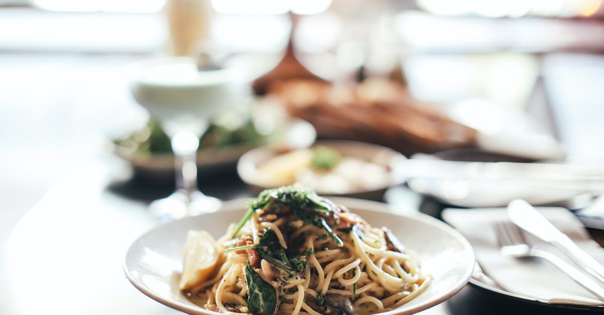 Fresh basil storage - Pasta Dish on White Ceramic Plate Fresh basil storage - Pasta Dish on White Ceramic Plate