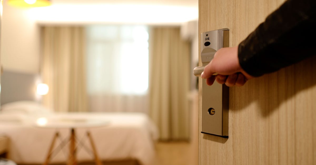 Fridge door left open - Person Holding on Door Lever Inside Room