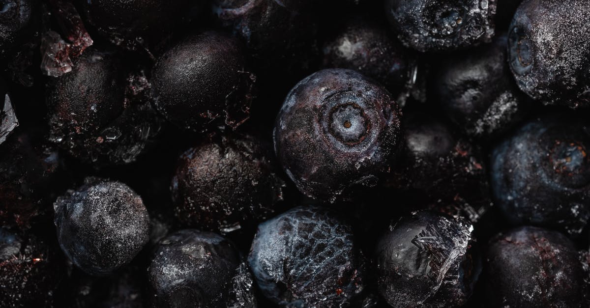 frozen blueberries kept thawed - Close-Up Shot of Frozen Blueberries frozen blueberries kept thawed - Close-Up Shot of Frozen Blueberries