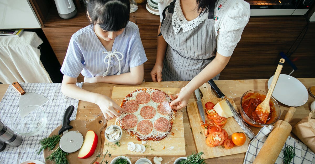 Frozen veggies meets gumbo = flavorless. How to add flavor? - Asian mother and daughter cooking pizza together