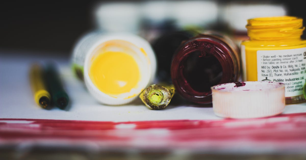 Fruit Oil Extraction - Selective Focus Photo of Opened Paint Containers Fruit Oil Extraction - Selective Focus Photo of Opened Paint Containers