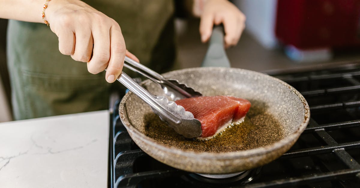 Frying Oil Reuse - Well Fried Fish Slice on Frying Pan Frying Oil Reuse - Well Fried Fish Slice on Frying Pan