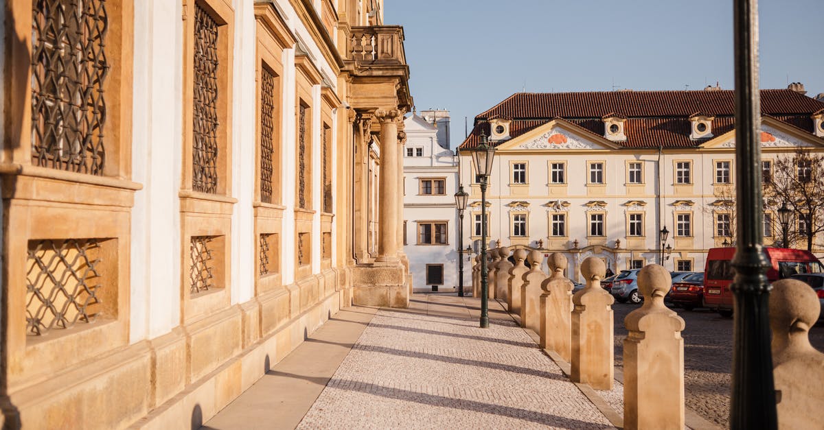 Furthering the dry aging process post purchase? - Empty walkway with shadows and old masonry house exteriors with fenced windows in sunny city Furthering the dry aging process post purchase? - Empty walkway with shadows and old masonry house exteriors with fenced windows in sunny city