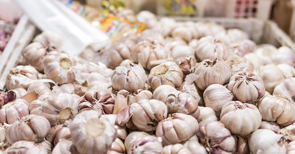 Garlic Cloves Size Differentiation - Garlic in Bucket Garlic Cloves Size Differentiation - Garlic in Bucket