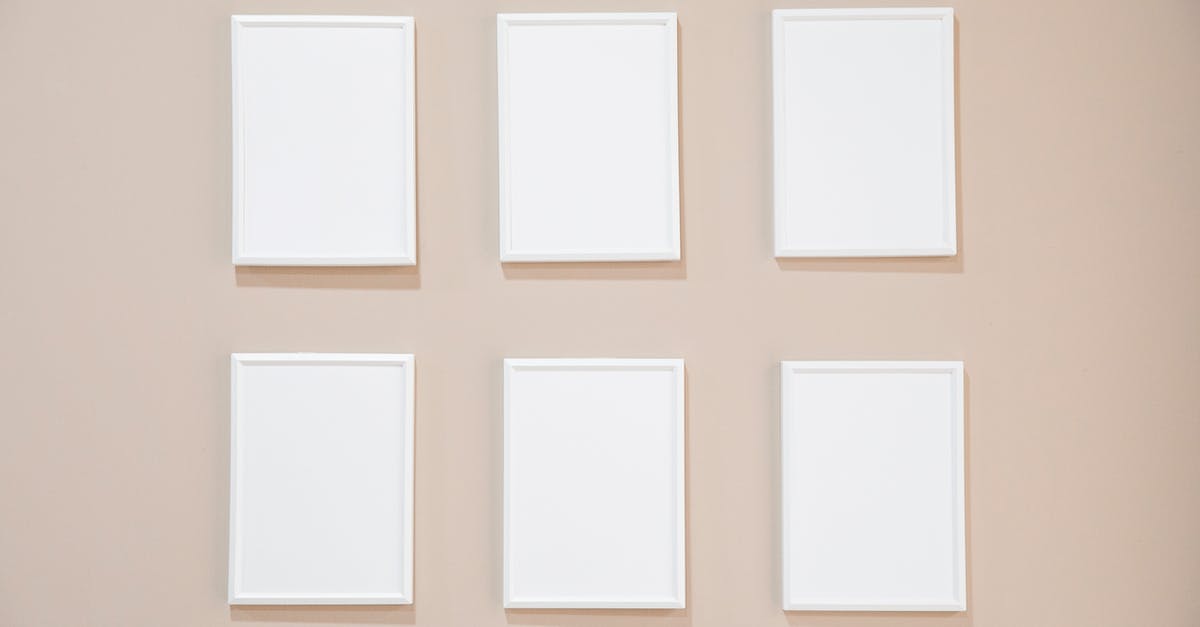 Gelling agents closest to normal gelatin that set at room temperature - Rows of blank white rectangular frames hanging on light pink wall in studio Gelling agents closest to normal gelatin that set at room temperature - Rows of blank white rectangular frames hanging on light pink wall in studio