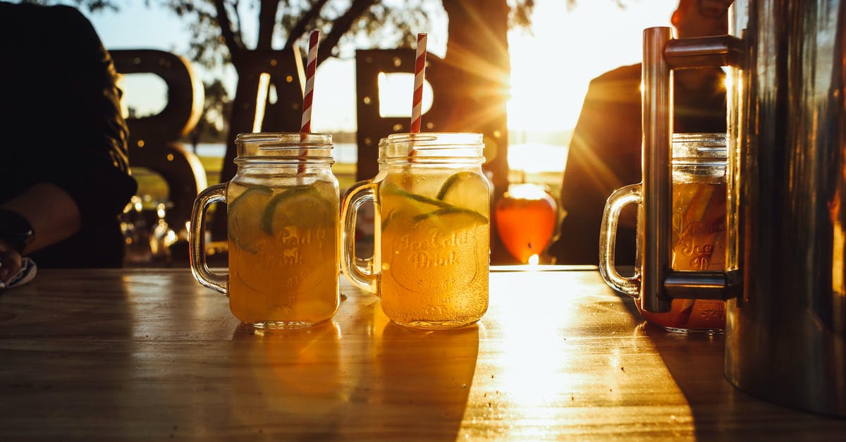 Getting rid of a commercial/plastic taste in icing? - Glass jar of cold drink with citrus fruit Getting rid of a commercial/plastic taste in icing? - Glass jar of cold drink with citrus fruit
