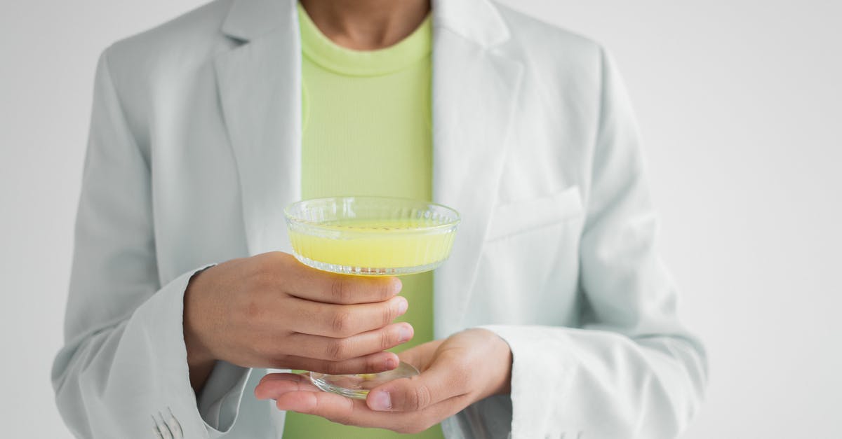 Getting the lighter fluid taste out of burgers, after the fact - Crop black woman with glass of cocktail Getting the lighter fluid taste out of burgers, after the fact - Crop black woman with glass of cocktail
