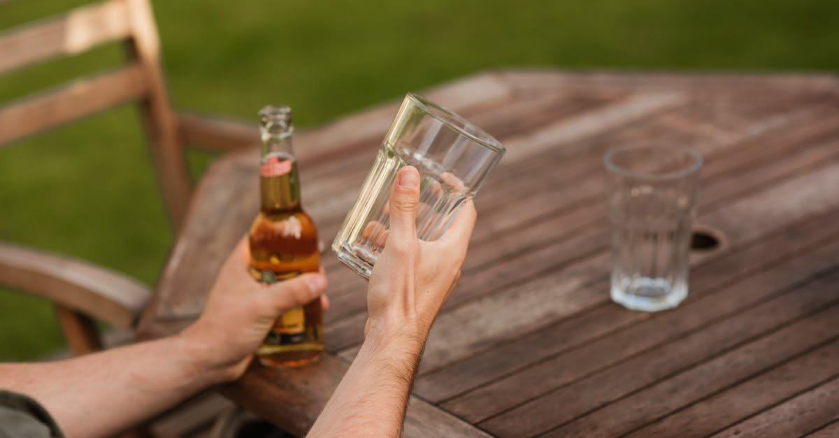 Getting the lighter fluid taste out of burgers, after the fact - Man with glass and beer bottle Getting the lighter fluid taste out of burgers, after the fact - Man with glass and beer bottle